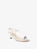Front 3/4 image of the Tee Toe Ring Sandals in cream/black