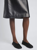 Model wearing the Soft Square Slippers in satin black