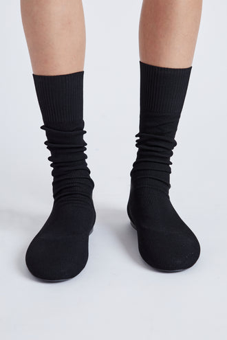 Image of model wearing Tee Knit Sock Boots in black