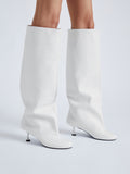 Image of model wearing Tee Knee High Boots in white