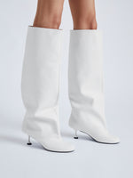 Image of model wearing Tee Knee High Boots in white