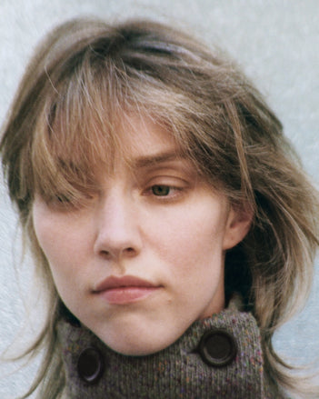 A cropped portrait of a model in the Proenza Schouler FW26 Campaign wearing Capucine jacket