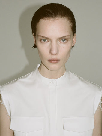 Cropped image of a model wearing Erica Dress in Organic Cotton Twill in off white.