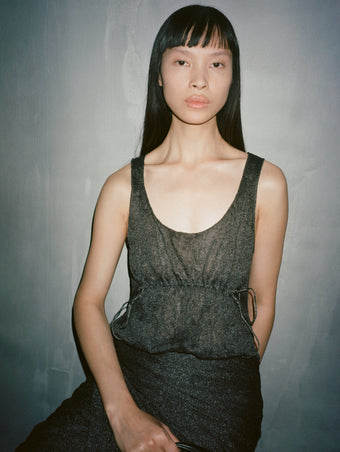 Cropped image of model wearing black dress