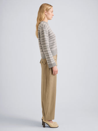 Proenza Schouler Side full length image of model wearing Pandora Sweater in Wool Stripe in Coal Grey