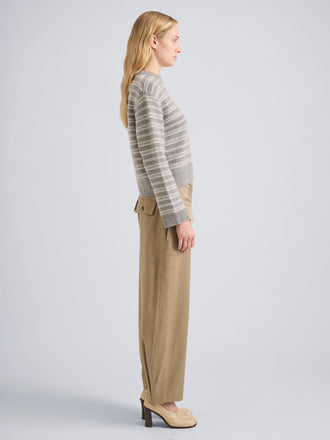 Proenza Schouler Side full length image of model wearing Pandora Sweater in Wool Stripe in Coal Grey