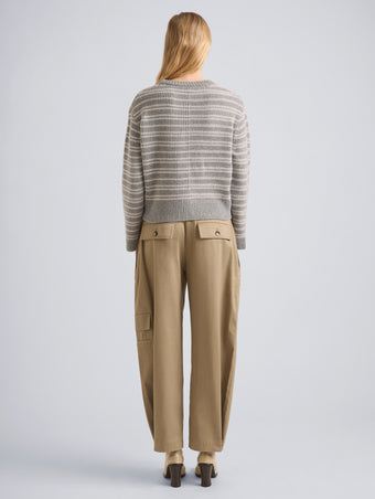 Proenza Schouler Back full length image of model wearing Pandora Sweater in Wool Stripe in Coal Grey