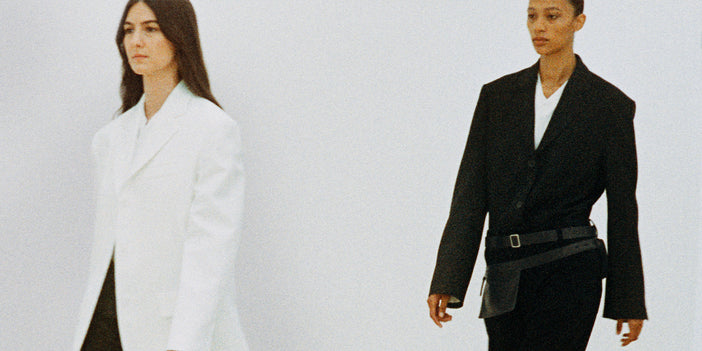 Image from the Proenza Schouler Spring 2024 Runway Show featuring Weyes Blood and Selena Forrest in a white and black suit