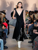 Runway image of model in Embroidered Velvet Dress in black