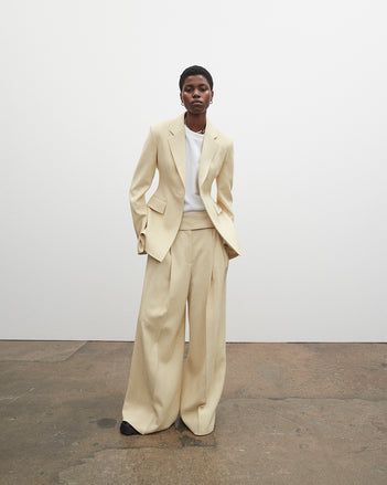 PF23 Collection Look 14: Parchment Viscose Suiting Jacket, White Terry Jersey T-Shirt, Parchment Viscose Suiting Pant, and Black Stomp Mules