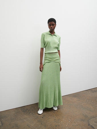 PF23 Collection Look 22: Green Metallic Knit Polo, Green Metallic Knit Dress, and Optic White Sculpt Ankle Boots