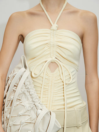 PF23 Collection Look 04: Ecru Compact Jersey Bodysuit, Parchment Viscose Suiting Pant, and Ecru Macrame Drawstring Tote