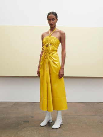 PF23 Collection Look 06: Yellow Glossy Leather Dress and Optic White Sculpt Ankle Boots
