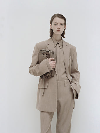 PS24 Look 17 - Khaki Melange Maya Shirt in Melange Wool, Khaki Melange Barbara Pant in Melange Wool, Khaki Melange Laurie Jacket, Mushroom Beacon Saddle Bag, and Silver Bronco Ankle Boots