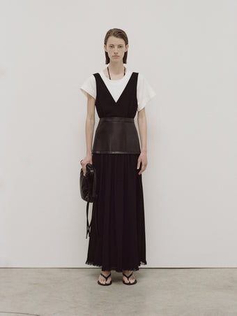 PS24 Look 02 - Black Viviane Dress, White Hopper T-shirt, Black Nylon Drawstring Pouch, and Black Spike Flip-flops.