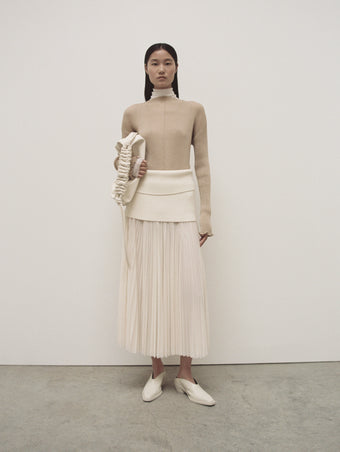 PS24 Look 20 - Sand Camille Top, White Sheer Viscose Knit Top, Ecru Kiki Skirt, Ivory Medium Drawstring Shoulder Bag, and Cream Bronco Mules