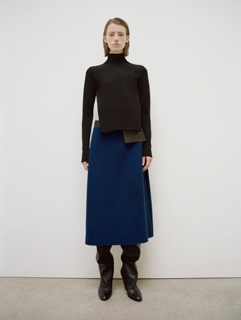 PS24 Look 22 - Black Claude Sweater, Navy Joan Skirt in Bi-stretch Wool, and Black Cone Boots