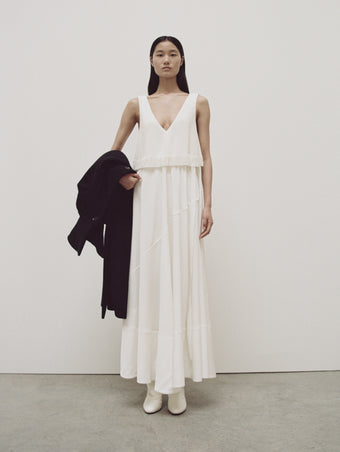 PS24 Look 23 - Off White Lynda Dress in Textured Marocaine With Boucle, Black Louise Coat, and Cream Cone Boots
