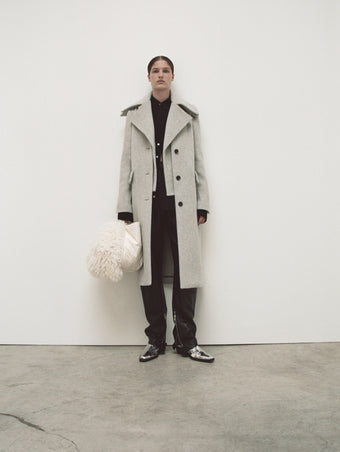 PS24 Look 07 - Black Maya Shirt in Textured Marocaine, Black Jackson Cargo Pant in Grainy Leather, Light Grey Melange Louise Coat, Ivory Large Puffy Nappa Ruched Tote, Silver Bronco Ankle Boots, and Ecru Curly Shearling Scarf