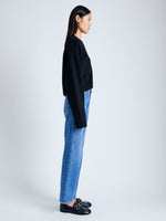 Side image of model wearing Eco Cashmere Cardigan in BLACK