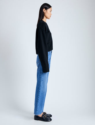 Side image of model wearing Eco Cashmere Cardigan in BLACK