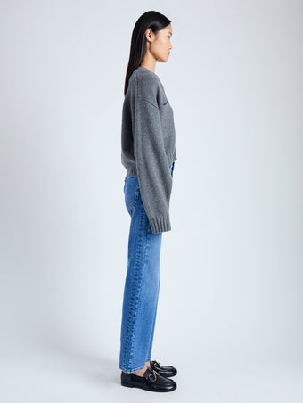 Side image of model wearing Eco Cashmere Cardigan in GREY MELANGE