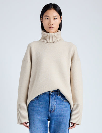 Front cropped image of model wearing Doubleface Eco Cashmere Oversized Turtleneck Sweater in OATMEAL