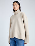 Detail image of model wearing Doubleface Eco Cashmere Oversized Turtleneck Sweater in OATMEAL