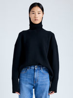 Front cropped image of model wearing Doubleface Eco Cashmere Oversized Turtleneck Sweater in BLACK