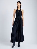Front image of model wearing Frida Halter Dress in Sheer Pleated Chiffon in black