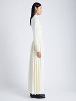 Side image of model wearing Meret Dress In Crepe Jersey in ivory