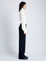 Side image of model wearing Sonia Top in Crepe Jersey in ivory