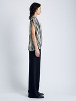 Side image of model wearing Wade Top in Printed Sheer Pleated Chiffon