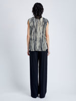 Back image of model wearing Wade Top in Printed Sheer Pleated Chiffon