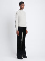 Side image of model wearing Camilla Sweater In Lofty Eco Cashmere in light grey melange