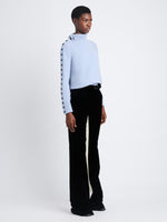 Side view of model wearing Camilla Sweater In Lofty Eco Cashmere in pale blue