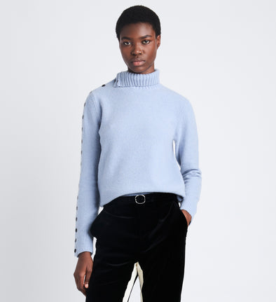 Cropped front view of model wearing Camilla Sweater In Lofty Eco Cashmere in pale blue