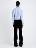 Back view of model wearing Camilla Sweater In Lofty Eco Cashmere in pale blue