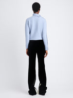 Back view of model wearing Camilla Sweater In Lofty Eco Cashmere in pale blue