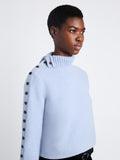 Detail view of model wearing Camilla Sweater In Lofty Eco Cashmere in pale blue