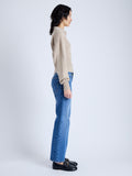 Side image of model wearing Jeanne Sweater In Eco Cashmere in oatmeal