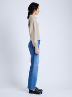 Side image of model wearing Jeanne Sweater In Eco Cashmere in oatmeal