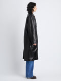 Side image of model wearing Billie Coat in Leather in black 