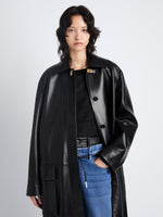 Detail image of model wearing Billie Coat in Leather in black 