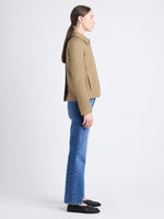 Side full length image of model wearing Lana Jacket In Eco Cotton Twill in DRAB