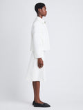Side full length image of model wearing Lana Jacket In Eco Cotton Twill in EGGSHELL