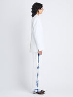 Side image of model in Sandis Jacket In Cotton Viscose in white
