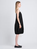 Side full length image of model wearing Emilia Dress In Lightweight Crinkle Poplin in BLACK
