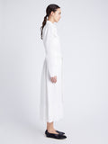 Side image of model wearing Vanessa Dress in Matte Viscose Crepe in white