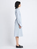 Side full length image of model wearing Olympia Dress In Washed Habotai in STEEL
